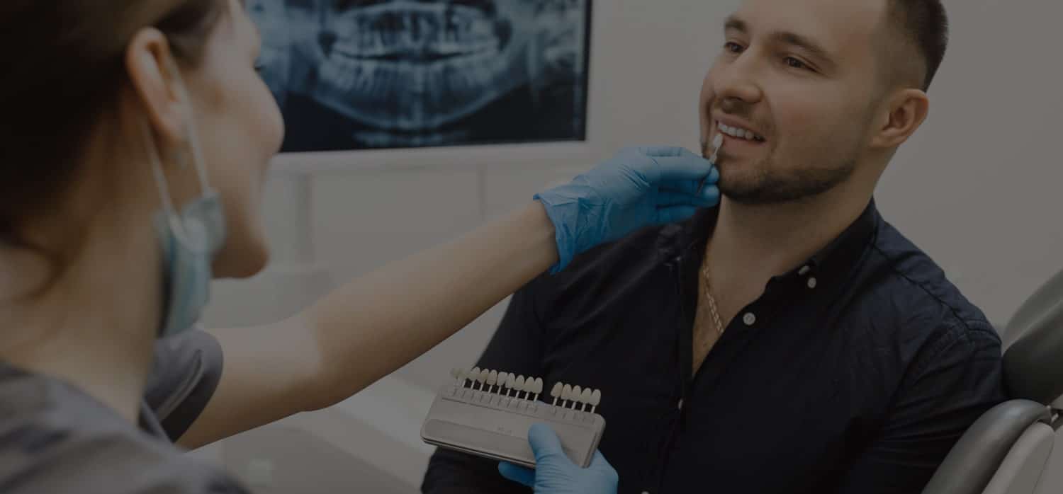 man during teeth whitening consultation at the smile studio