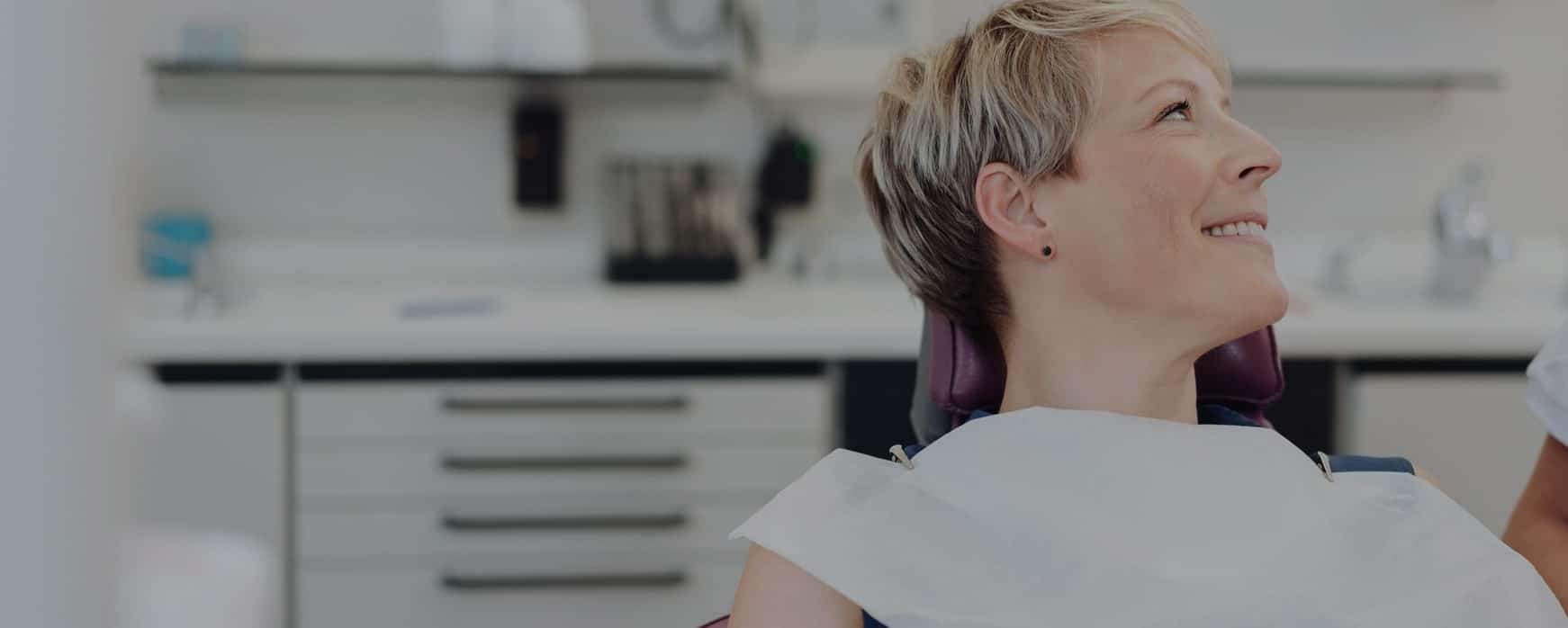 woman during a dentist appointment at the smile studio